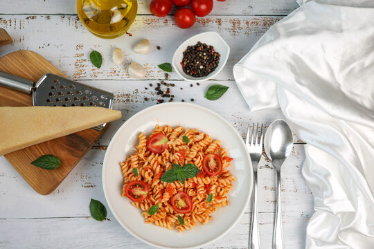 fusilli pasta with tomato sauce and basil