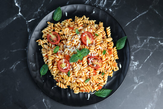 fusilli pasta with tomato sauce and basil