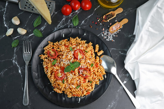 fusilli pasta with tomato sauce and basil