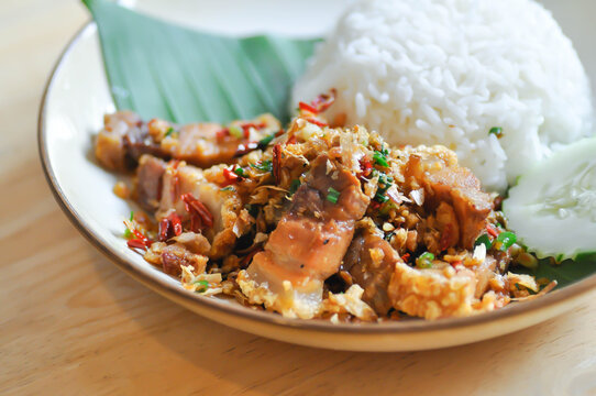 stir fried pork or deep fried pork , fried pork or crispy pork and rice or  belly of pork