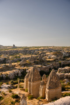 High angle view of unique volcanic tuff rock formations and fairy chimneys in Cappadocia. Love Valley Cappadocia Turkey, geological tourism, historical landmark exploration and wilderness travel