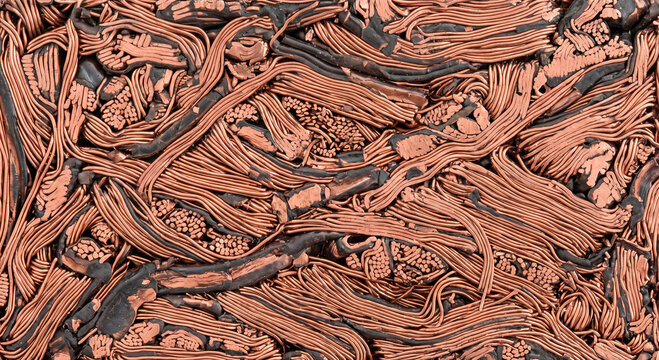 Compressed mass of shiny enamel coated copper wire forming flat pressed texture