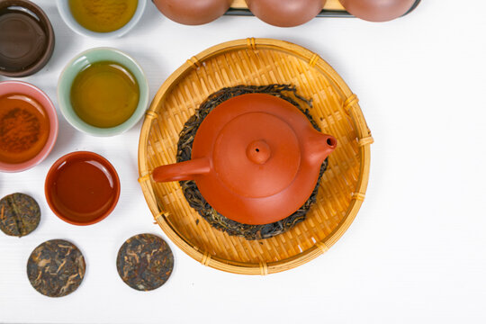 Traditional chinese tea ceremony with yixing clay teapot and puerh tea on bamboo tray. Authentic asian tea culture set for relaxation and meditation. Flat lay view of beverage ritual