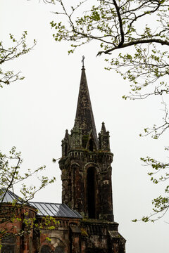 Neo-Gothic spire of the Chapel of Nossa Senhora das Vit&oacute;rias on Lagoa das Furnas