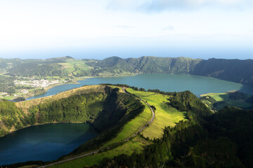 The lush volcanic landscape of Sete Cidades surrounds two striking crater lakes on São Miguel Island. © Евгения Руденок