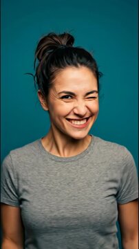 Young Woman Expressing Various Emotions Including Surprise and Joy Against a Dynamic Teal Background