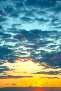 Sunset over the horizon with clouds in the sky during evening hours