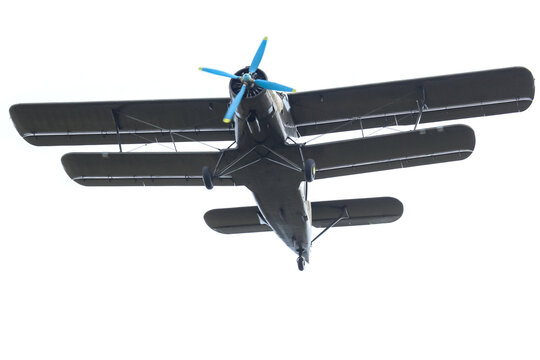 Old aircraft flying in the sky during the daytime, showing its propeller and wings