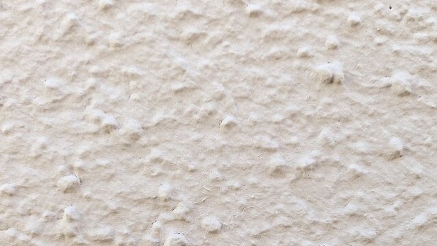 Light beige bumpy plaster background texture