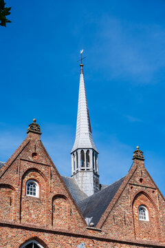 Pointed bell tower of old puritan church in the Nederlands