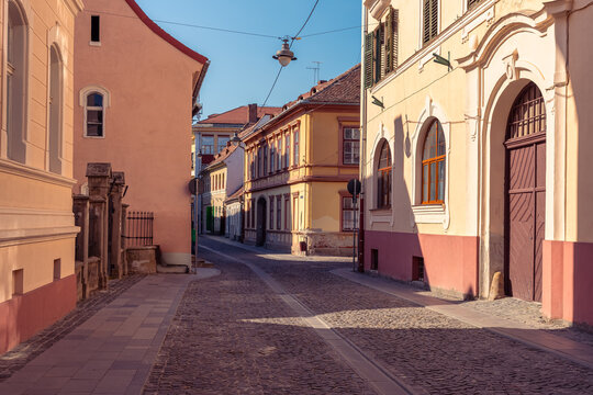 Quiet cobblestone street with historic facades in the old town of Sibiu, Transylvania, Romania