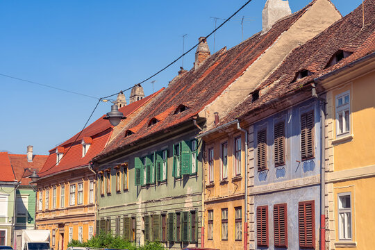 Traditional Sibiu houses with roof eyes and colorful facades in the old town of Transylvania, Romania