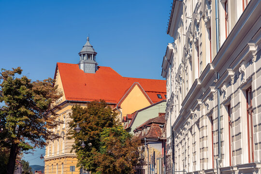 Historic Sibiu street with red tiled roofs and distinctive roof eyes in Transylvania, Romania