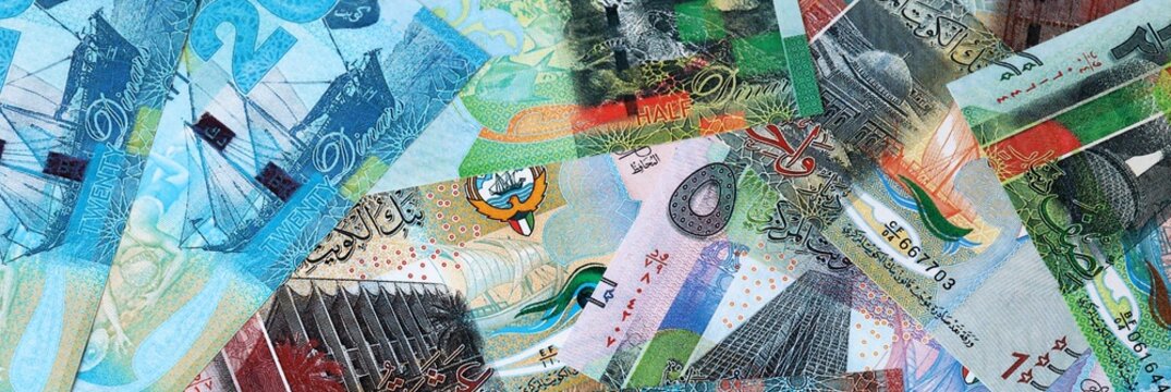 Kuwaiti dinar money bills in pile on table. Kuwait KWD currency cash close up