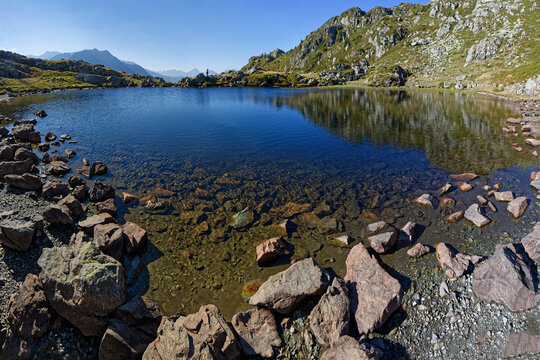 Rocks on the shore of the lake of Pas de la Coche in Belledonne