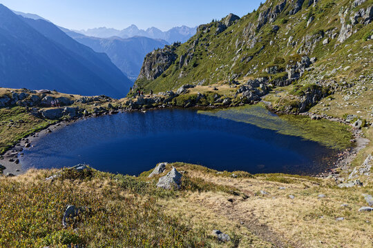 Lake of Pas de la Coche in Belledonne with peaks of Oisans in the background