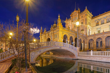 Night view of Plaza de Espana and tiled bridge in Seville © Dmitry Rukhlenko