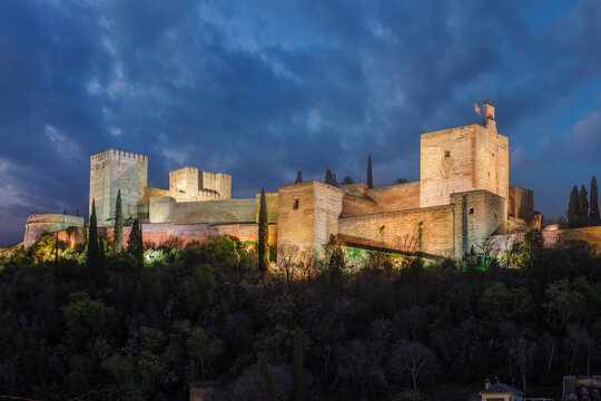 Illuminated Alcazaba of the Alhambra at twilight in Granada