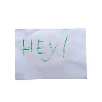 Handwritten hey word on a folded piece of paper