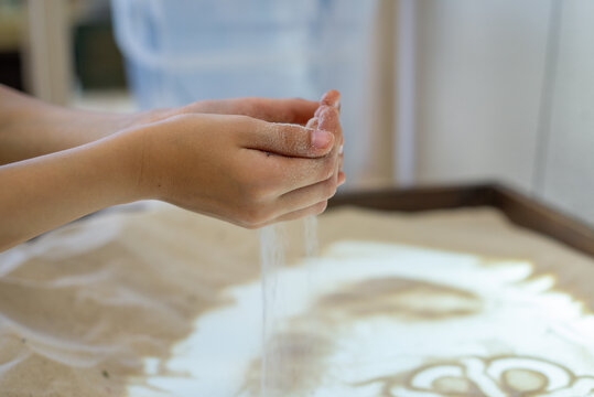 Art therapy for children. Sand animation and sand painting