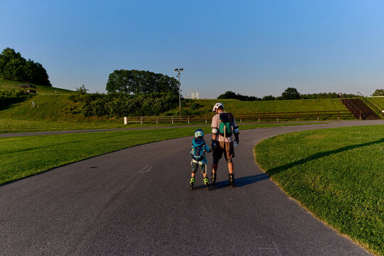 Father and Son Roller Skating Together