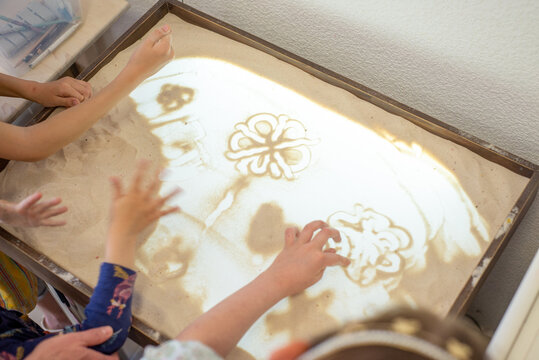 Art therapy for children. Sand animation and sand painting
