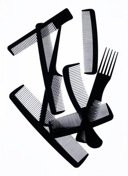 A group of black combs on a white background.