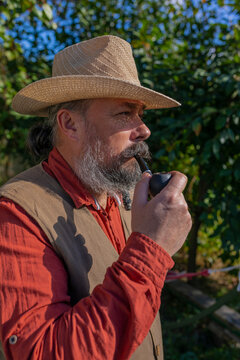 Portrait of a man smoking a pipe