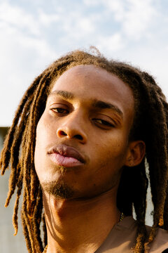 Headshot of a Black man looking at camera with an intense expression