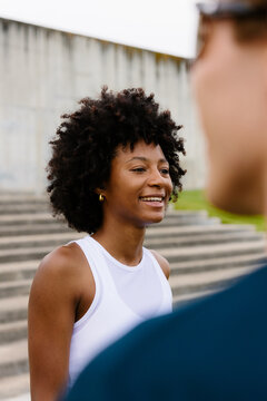 Female athlete chatting with her training partners during a break