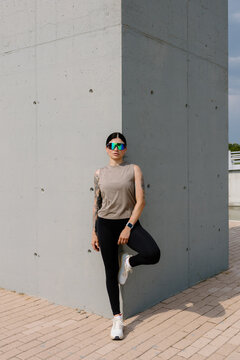 A dynamic portrait of a female athlete showing physical endurance