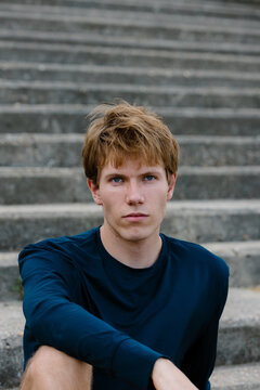 Close-up portrait of an athlete posing with a serious gaze