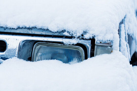 Snow Covered Car Headlight