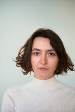 Portrait of a Woman With Short Hair and a White Sweater
