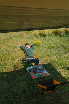 Relaxing Under Motorhome Awning