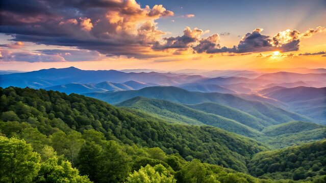 Panoramic mountain landscape at sunset with golden light over rolling green hills and clouds.