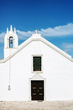 White Church With Bell Tower Under Blue Sky