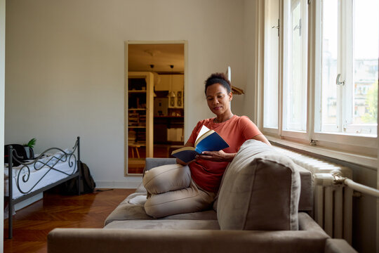 Woman reads at home