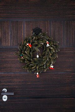Colorful Christmas Wreath Hanging on a Wooden Door