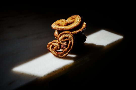 Baked Pastries on a Dark Background With Light Reflections
