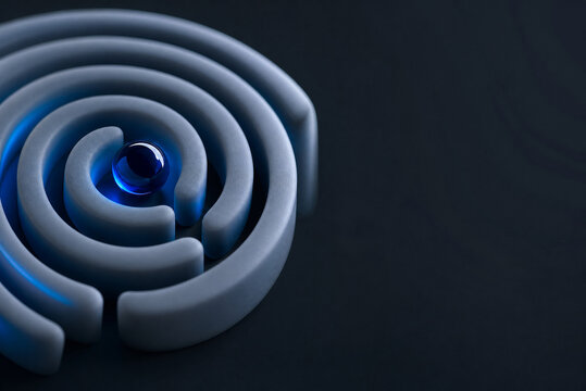 Abstract circular maze with blue marble, 3D puzzle labyrinth for business strategy, conceptual problem solving background