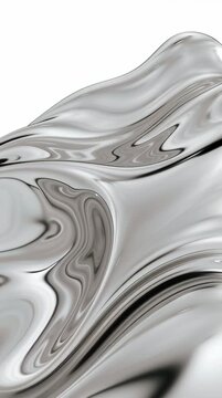 Metal appears to flow and ripple as light reflects off its surface in a dynamic way, creating interesting shapes and patterns.