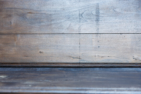 Wooden surface with textured grain and natural patterns in shades of brown