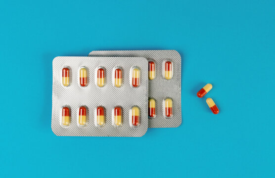 Pill Blister on Color Background, Silver Medicine Capsule Package, Drugs Packaging, Pill Pack