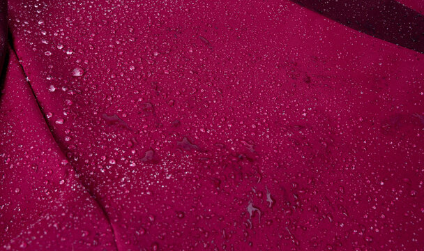 Waterproof fabric texture with rain drops closeup