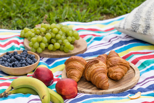Close up of food and drinks during picnic in a summer day.