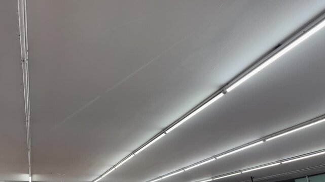 Minimalist indoor ceiling with bright linear LED light fixture