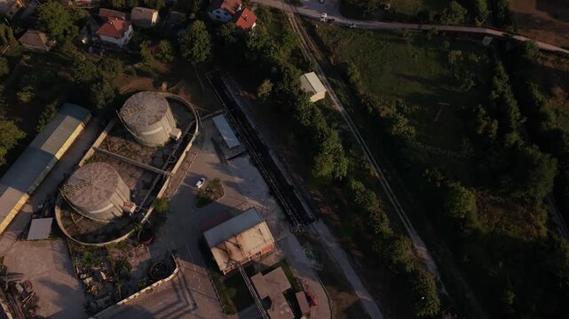 Aerial Top Down View of Kakanj Cement Factory Storage Silos Facility at Golden Hour Bosnia