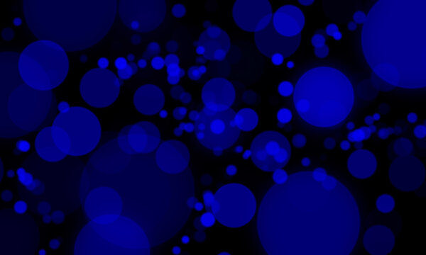 Glowing royal blue bokeh light circles abstract particle background with defocused blur effect on black