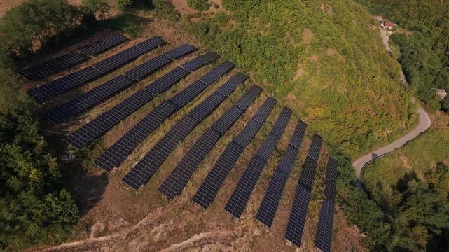 Aerial View of Solar Panel Farm Array Installed on Hillside Near Zenica Bosnia